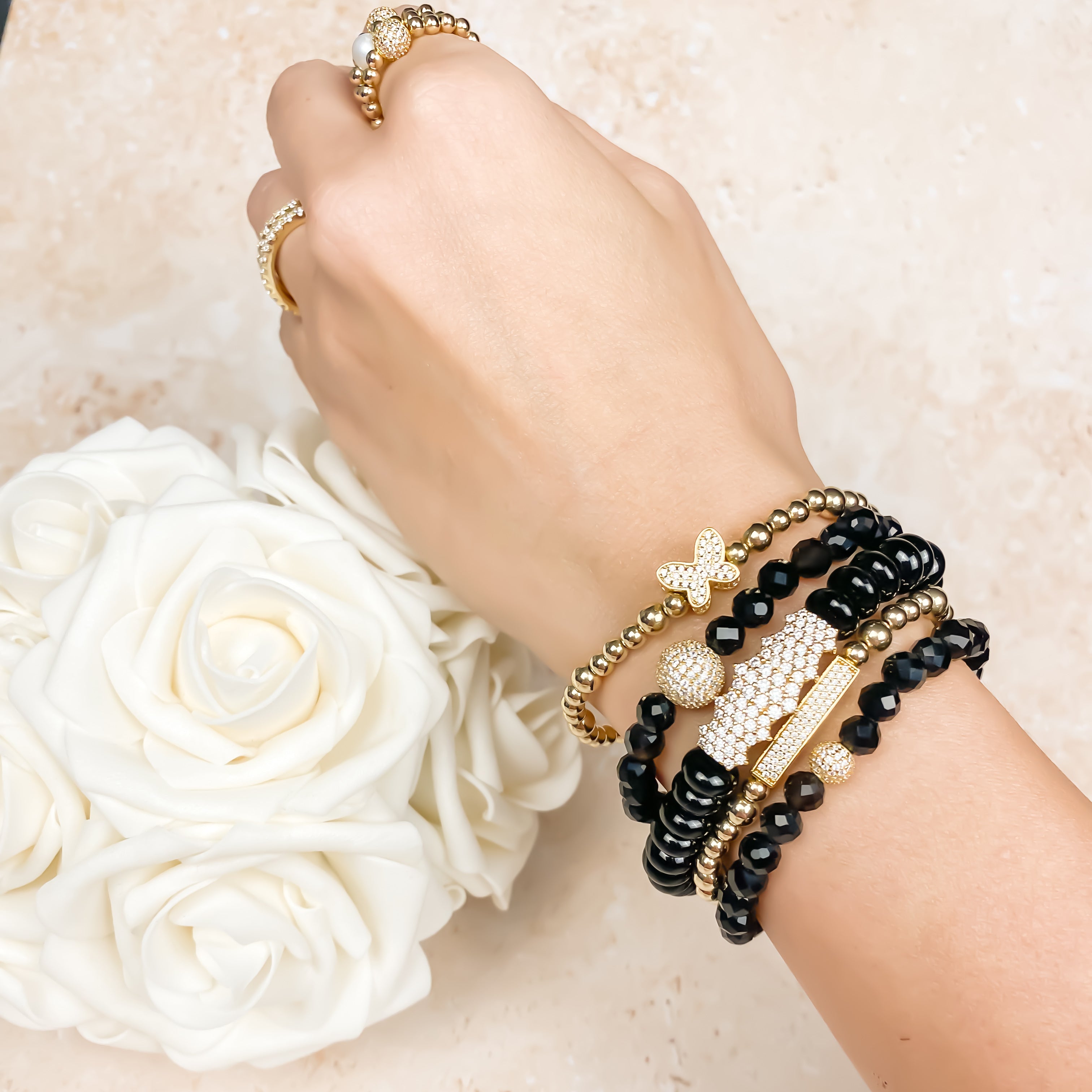 MINI CRYSTAL BALL ON BLACK ONYX ELASTIC BRACELET