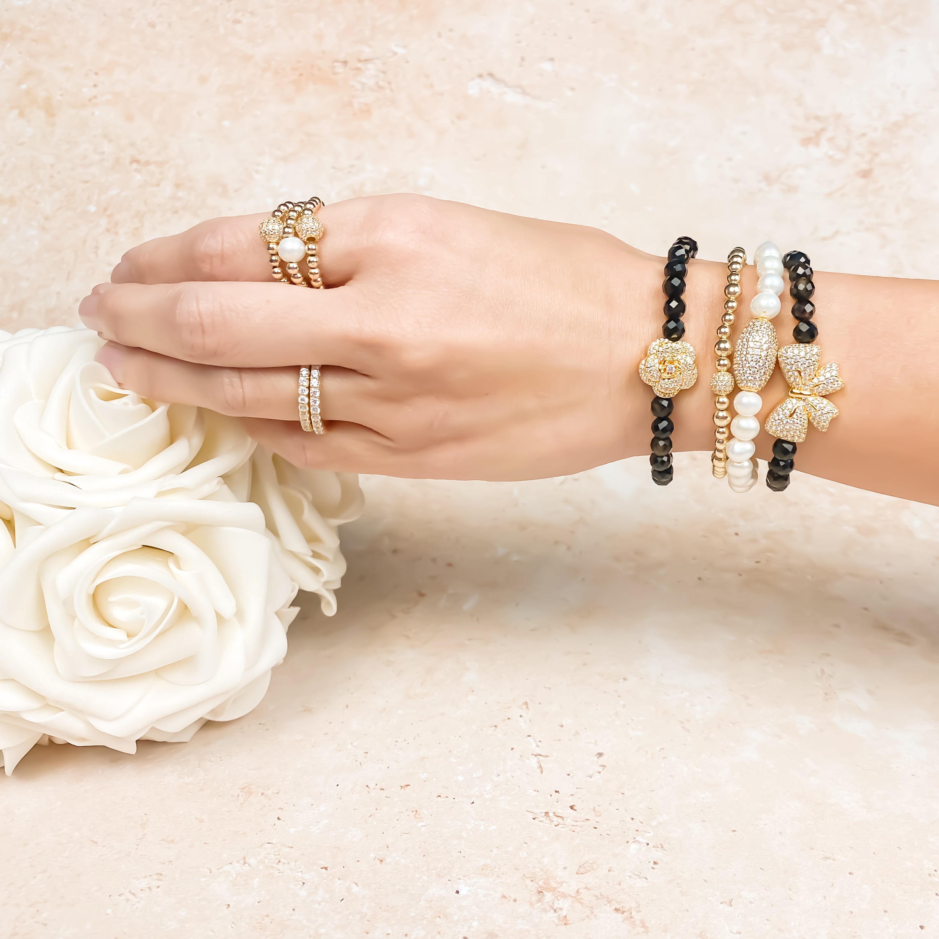 RIBBON ON BLACK ONYX ELASTIC BRACELET