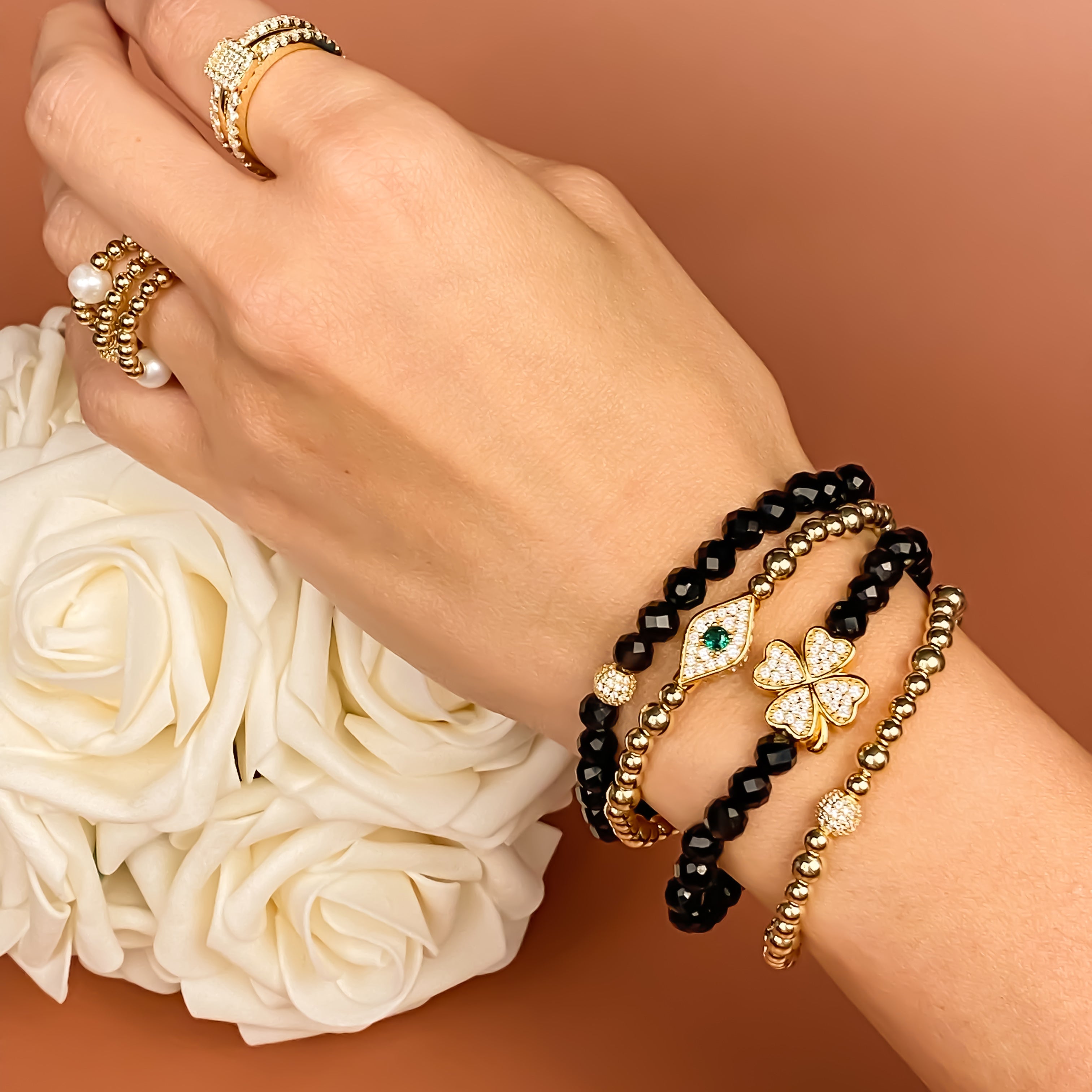 MINI CRYSTAL BALL ON BLACK ONYX ELASTIC BRACELET