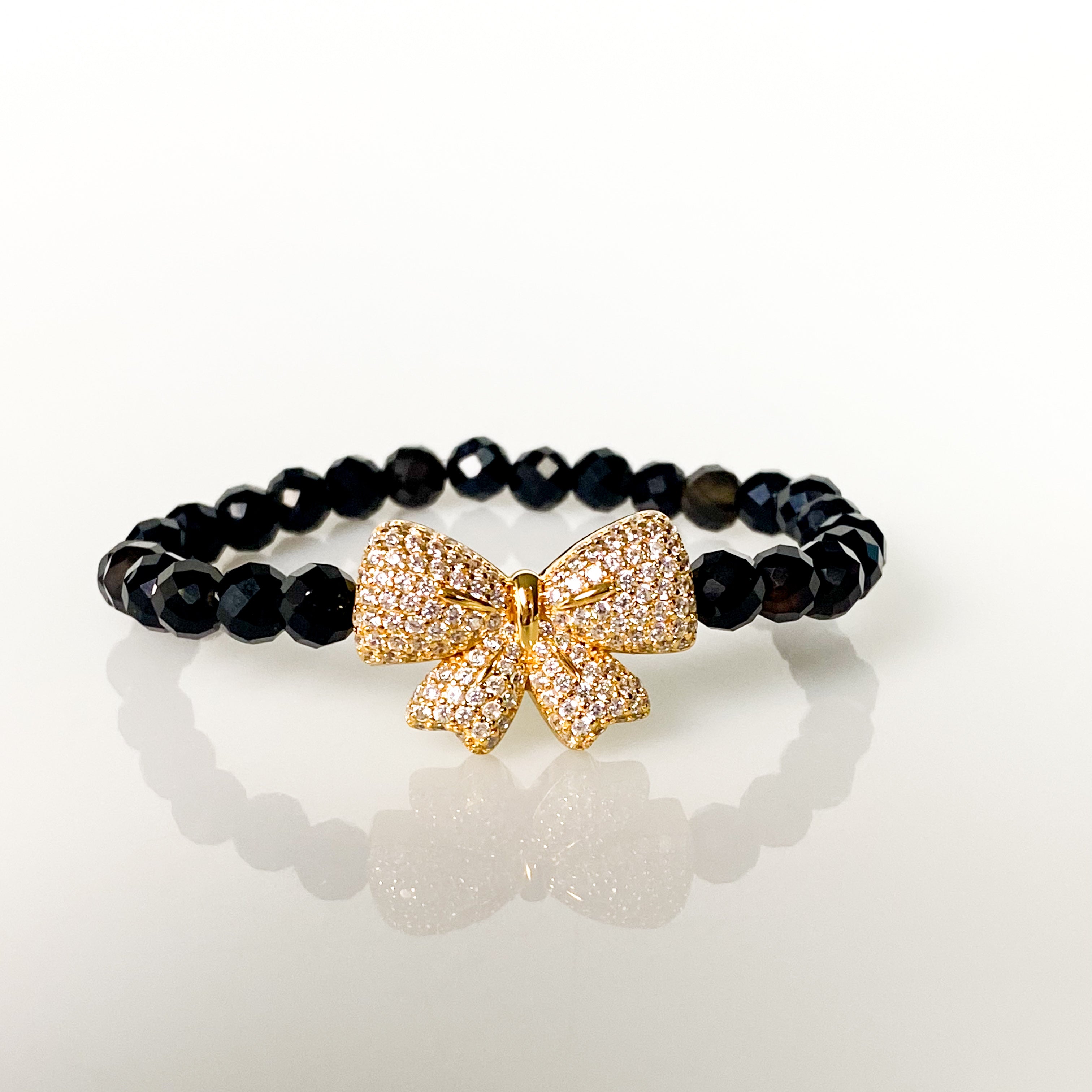 RIBBON ON BLACK ONYX ELASTIC BRACELET