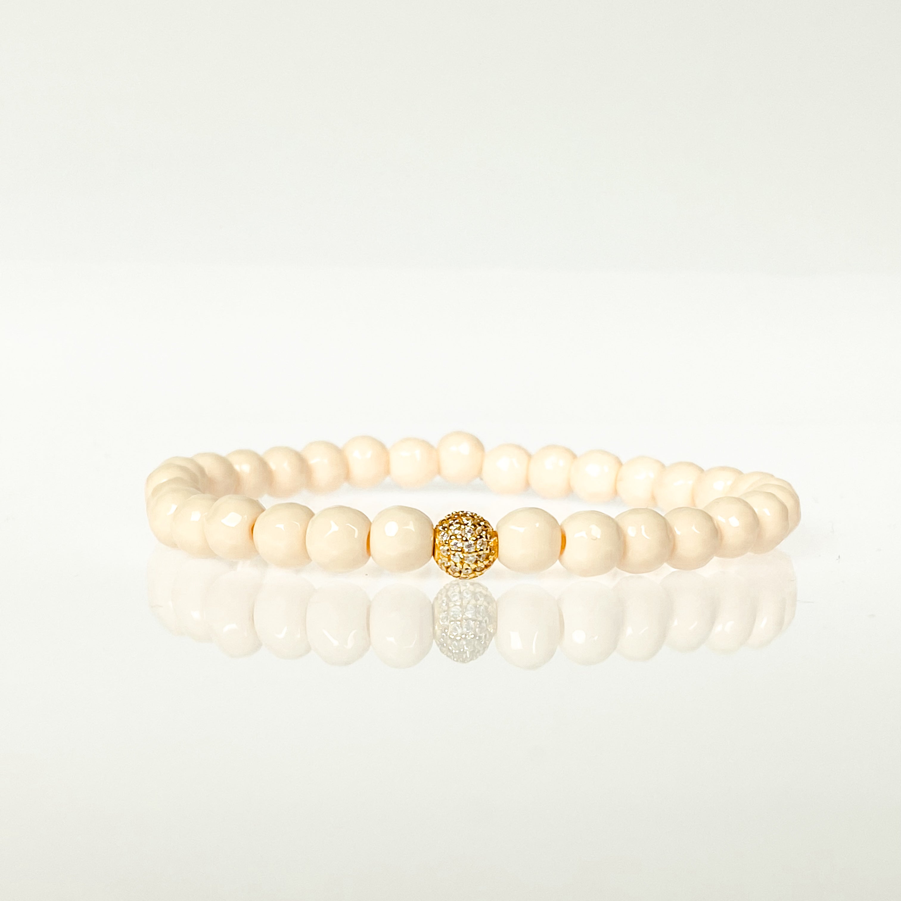 MINI CRYSTAL BALL ON FRENCH VANILLA ELASTIC BRACELET