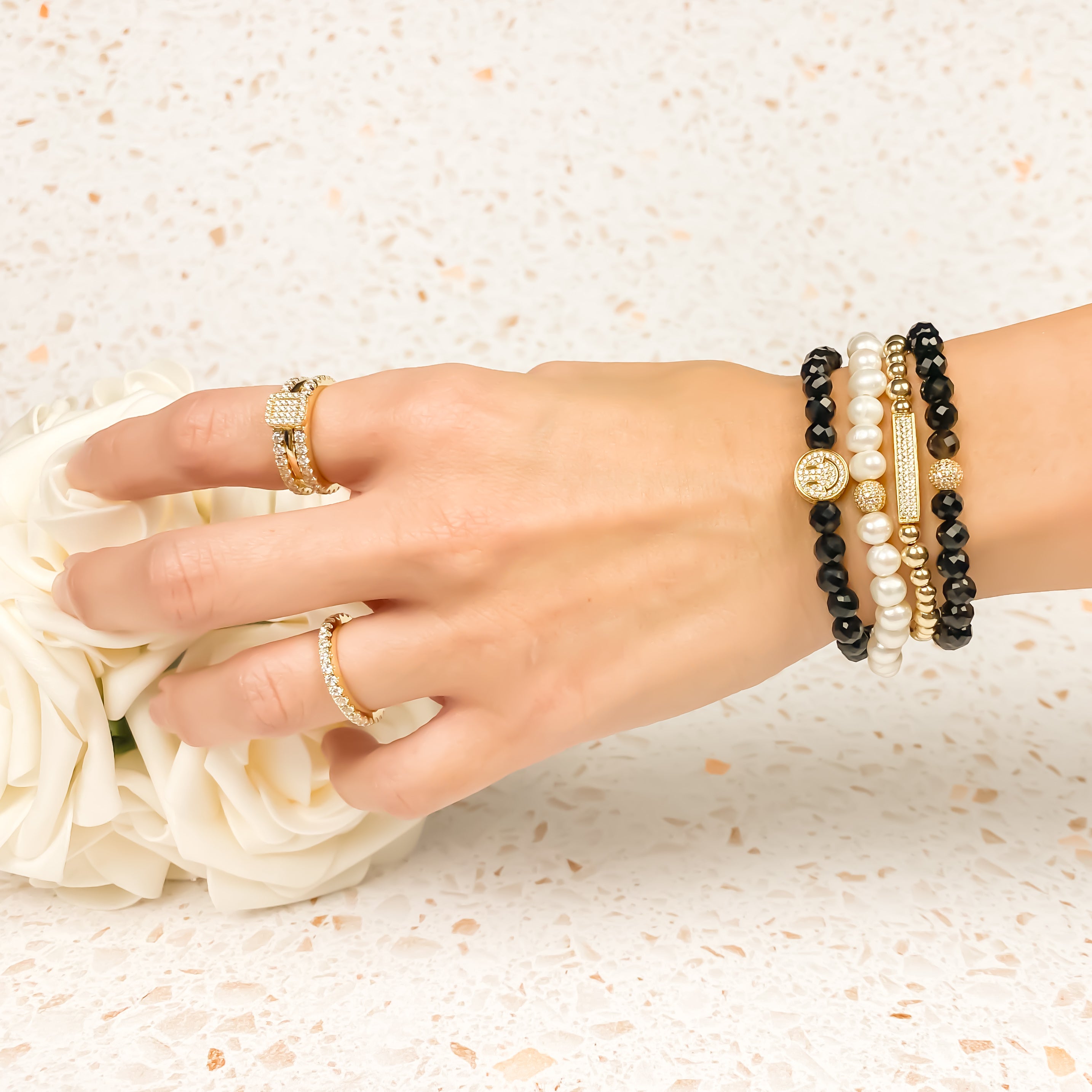 SMILEY FACE ON BLACK ONYX ELASTIC BRACELET