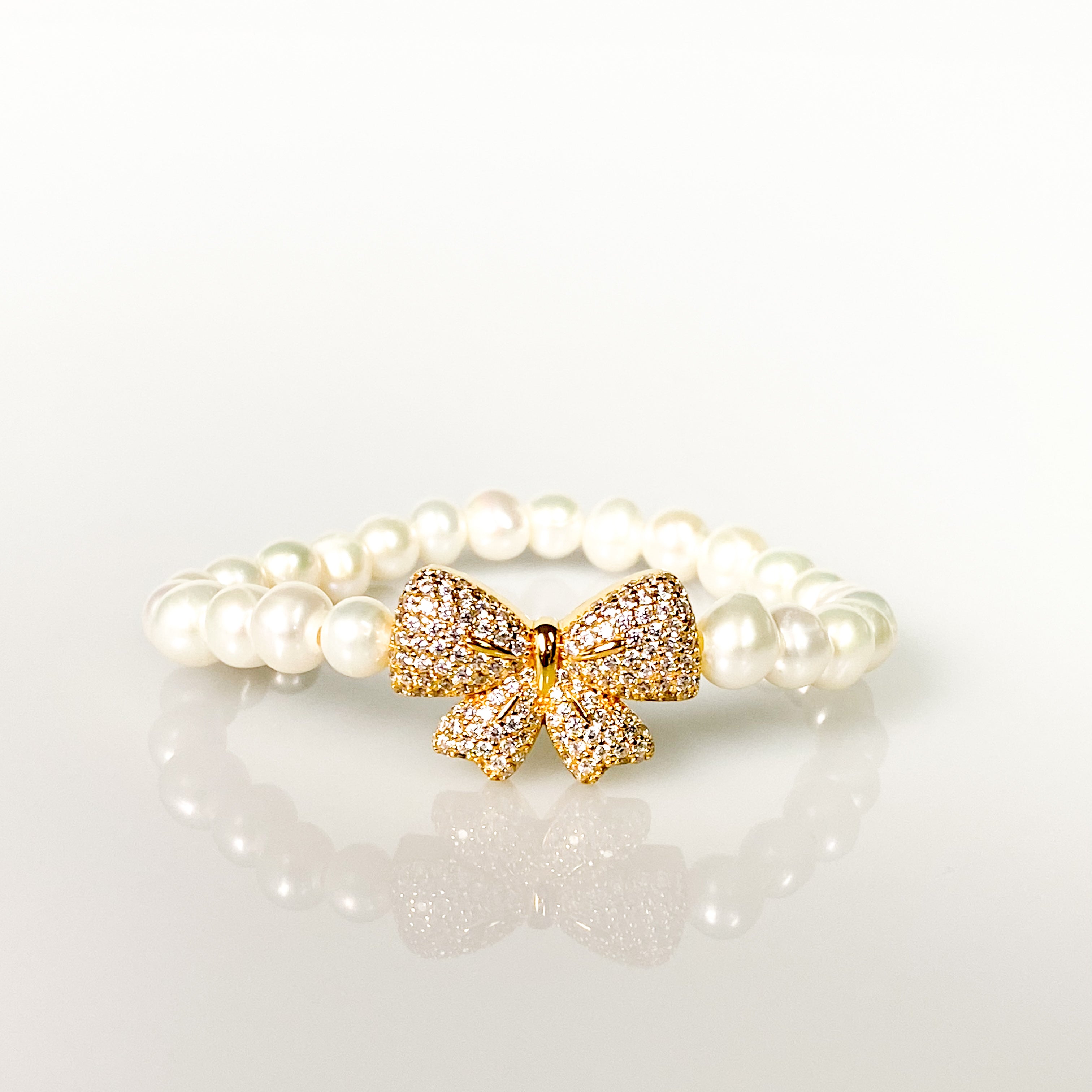 RIBBON ON WHITE PEARL ELASTIC BRACELET