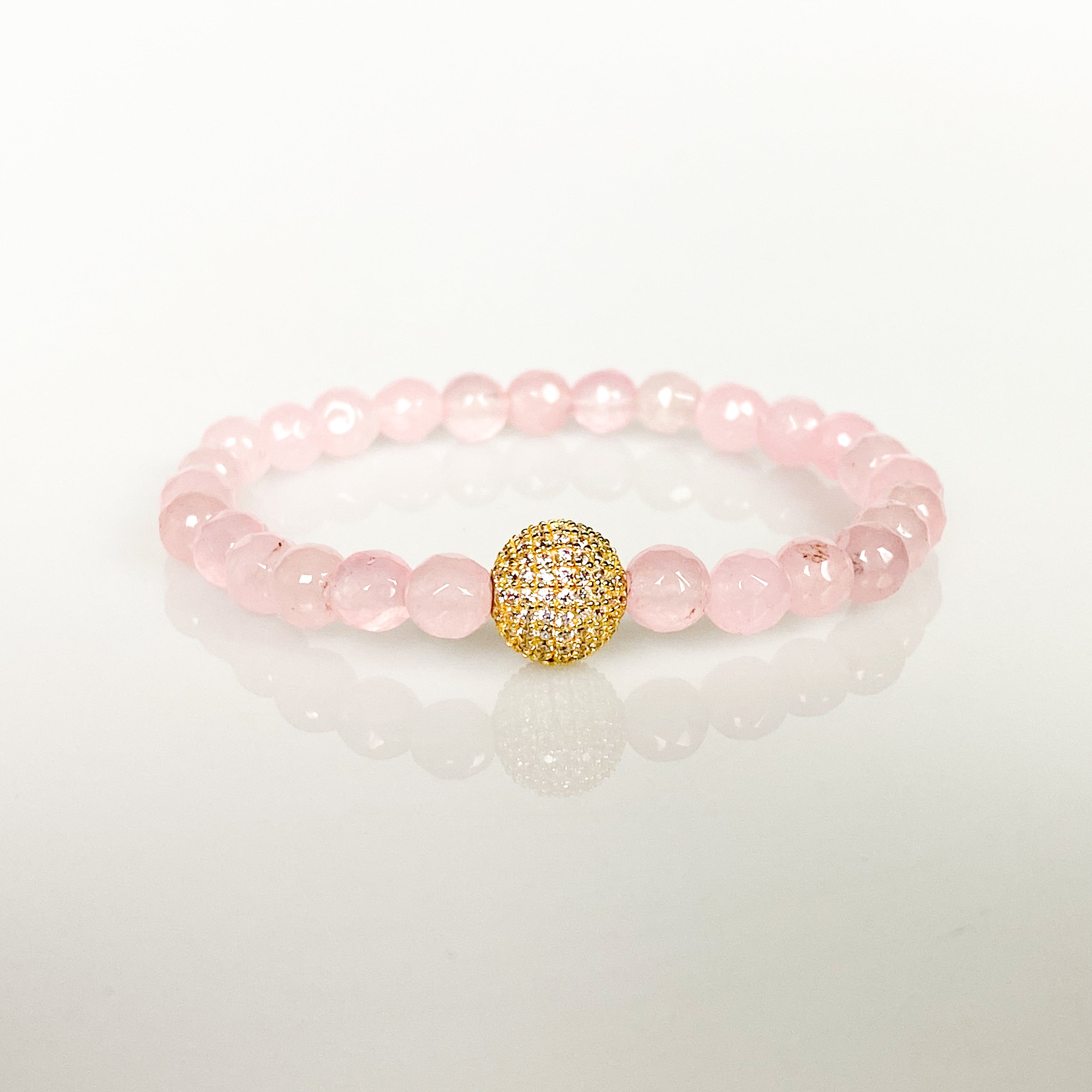 CRYSTAL BALL ON ROSE JADE ELASTIC BRACELET