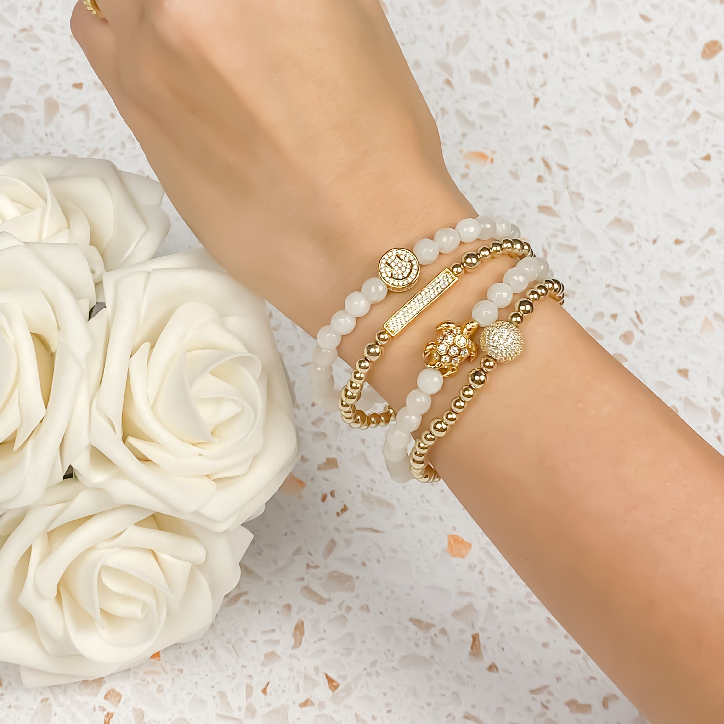 SMILEY FACE ON WHITE JADE ELASTIC BRACELET