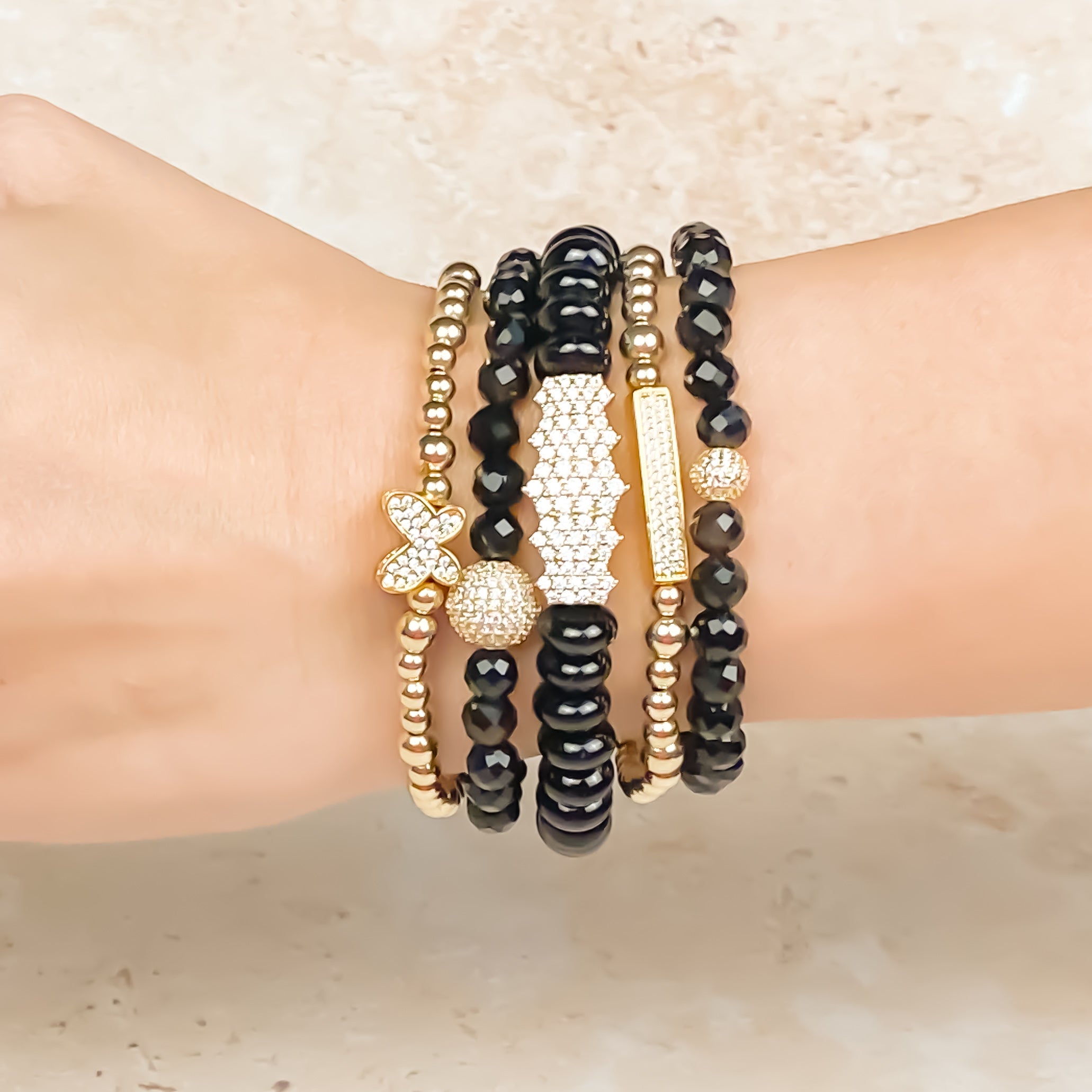 MINI CRYSTAL BALL ON BLACK ONYX ELASTIC BRACELET