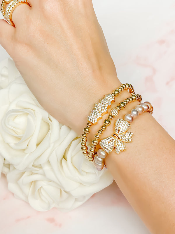 RIBBON OR PURPLE PEARL ELASTIC BRACELET