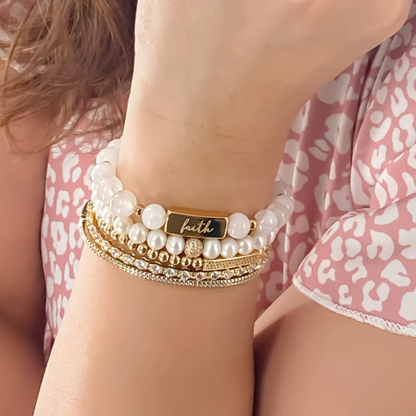 FAITH ON WHITE MOOSNTONE ELASTIC BRACELET