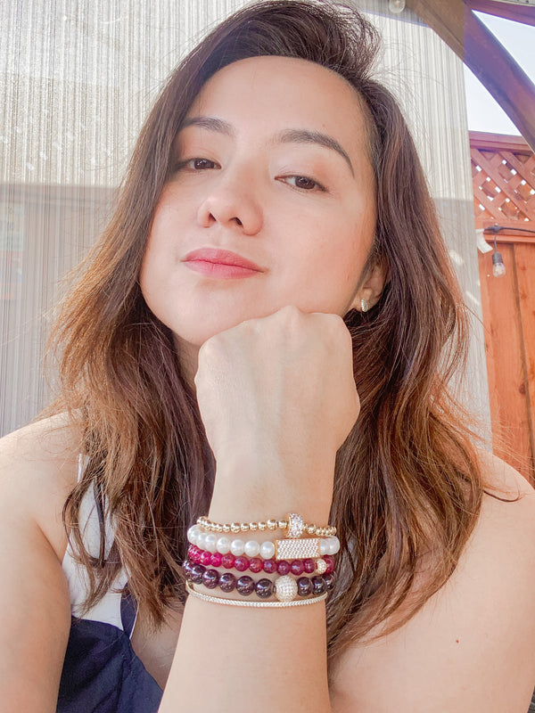 CRYSTAL BALL ON GARNET JADE ELASTIC BRACELET