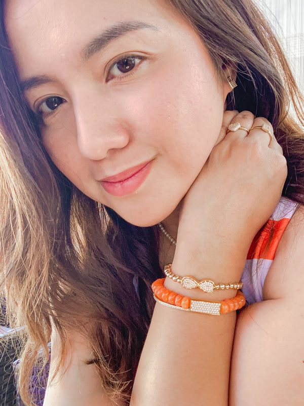 CRYSTAL BAR ON APRICOT JADE ELASTIC BRACELET